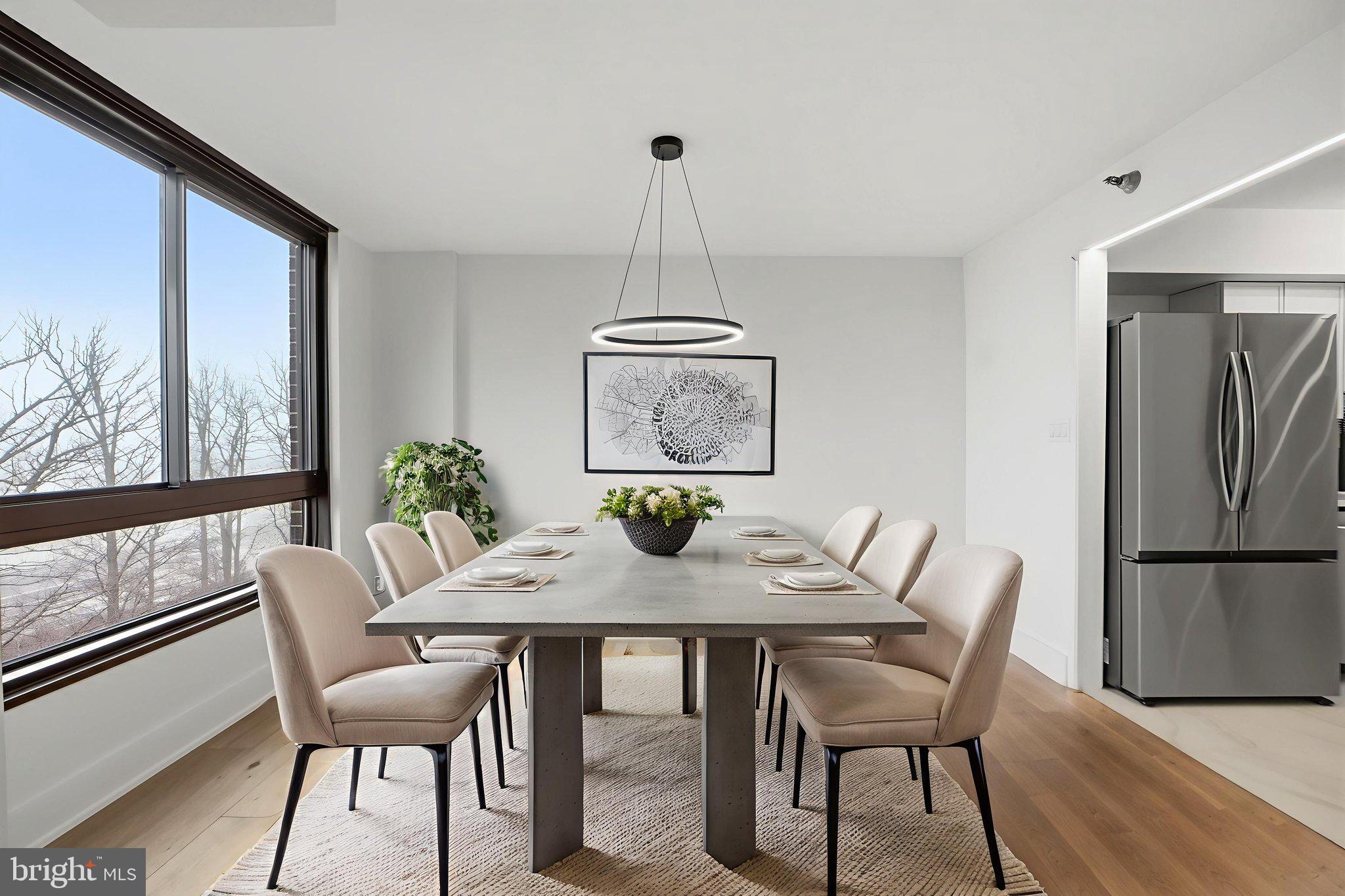 1808 Old Meadow Road, Unit 1201 McLean, VA 22102 - Photo 12 of 37 a view of a dining room with furniture window and wooden floor
