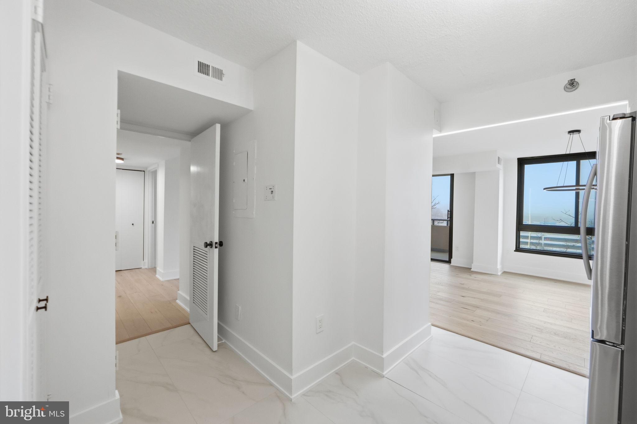 1808 Old Meadow Road, Unit 1201 McLean, VA 22102 - Photo 15 of 37 a view of a hallway with wooden floor