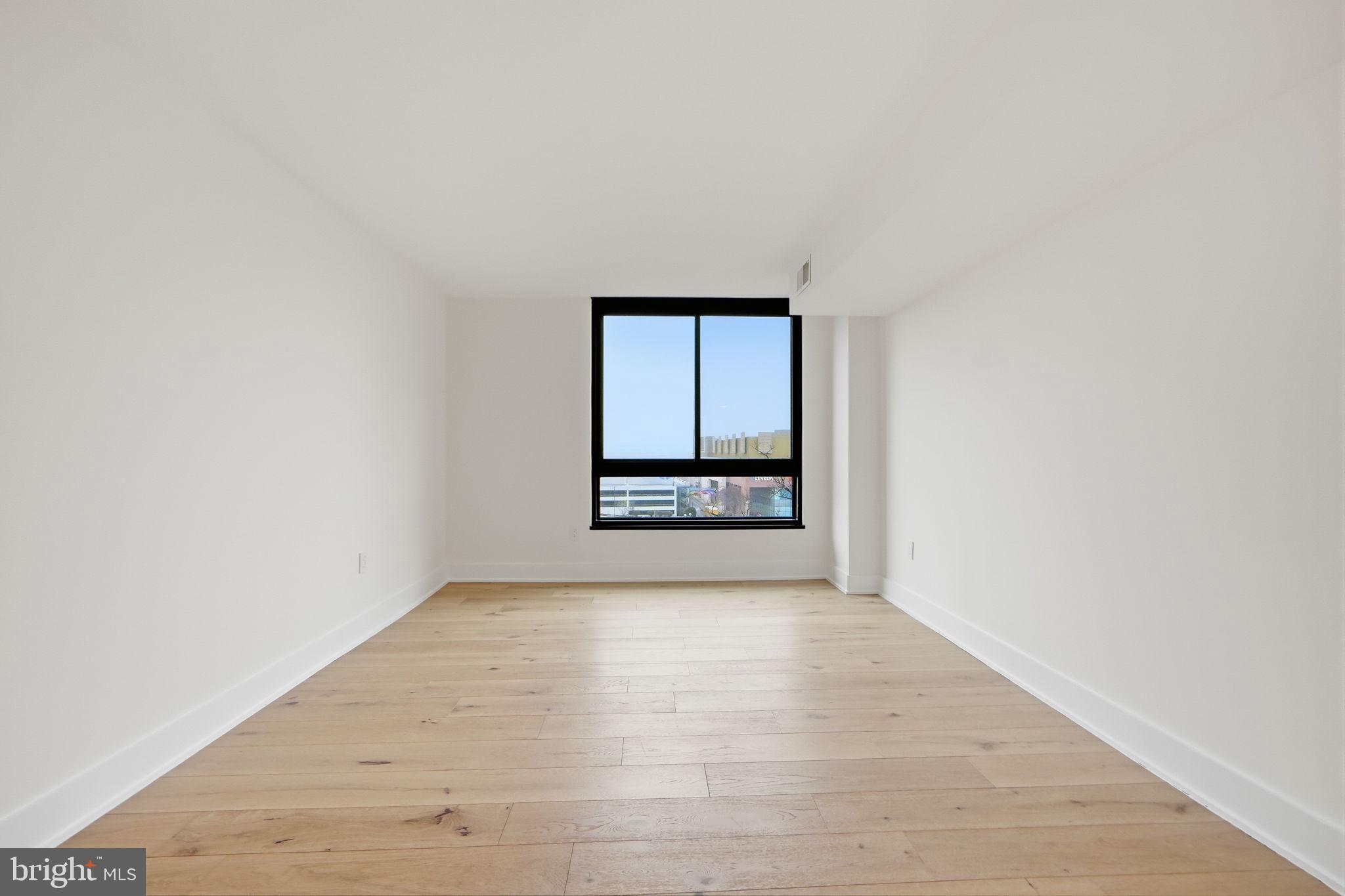 1808 Old Meadow Road, Unit 1201 McLean, VA 22102 - Photo 20 of 37 an empty room with a window