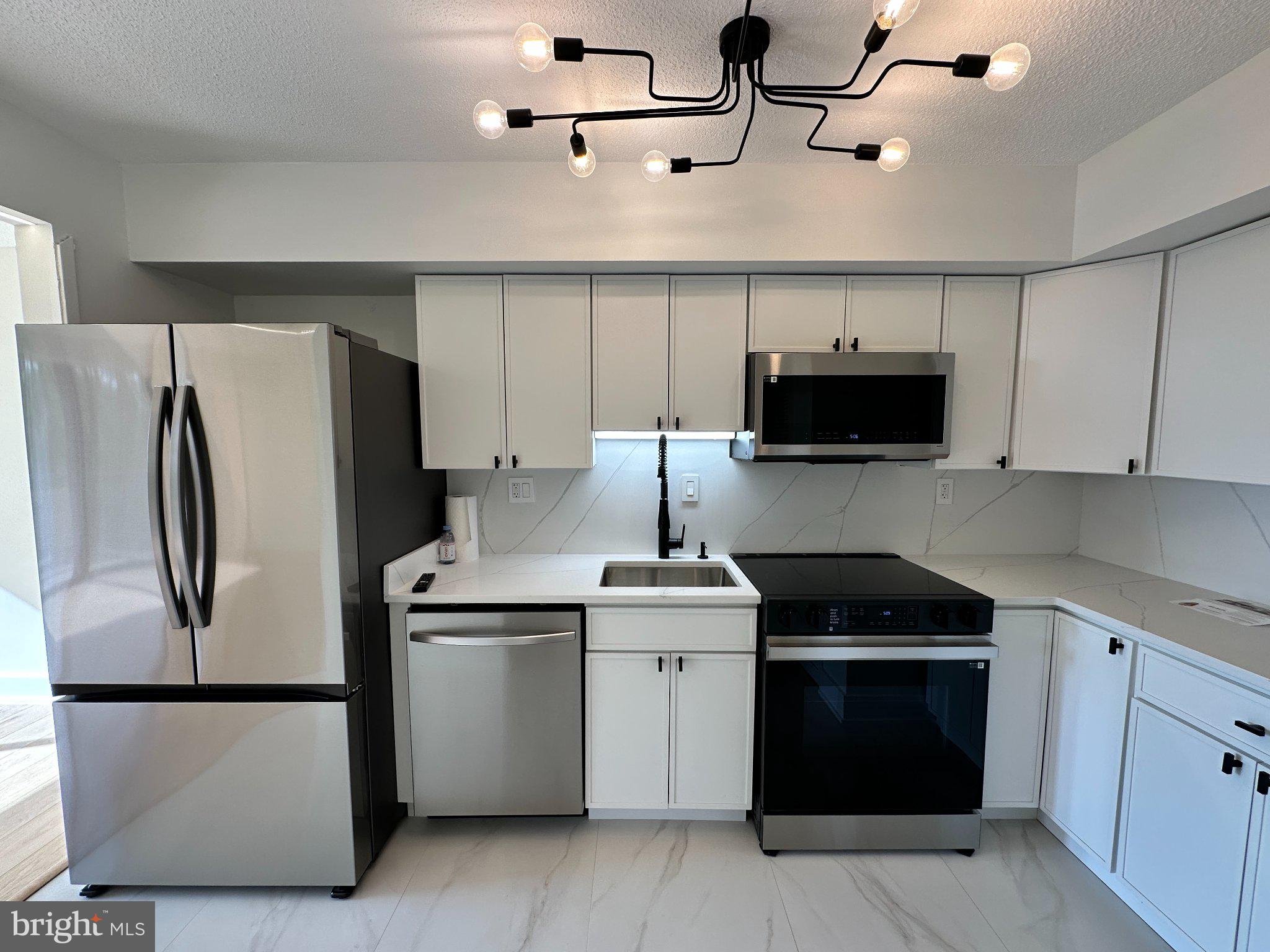1808 Old Meadow Road, Unit 1201 McLean, VA 22102 - Photo 2 of 40 Modern kitchen with sleek finishes.