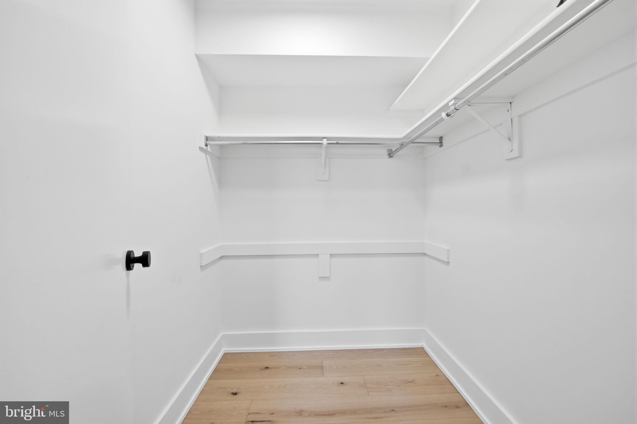 1808 Old Meadow Road, Unit 1201 McLean, VA 22102 - Photo 22 of 37 a view of walk in closet with empty racks