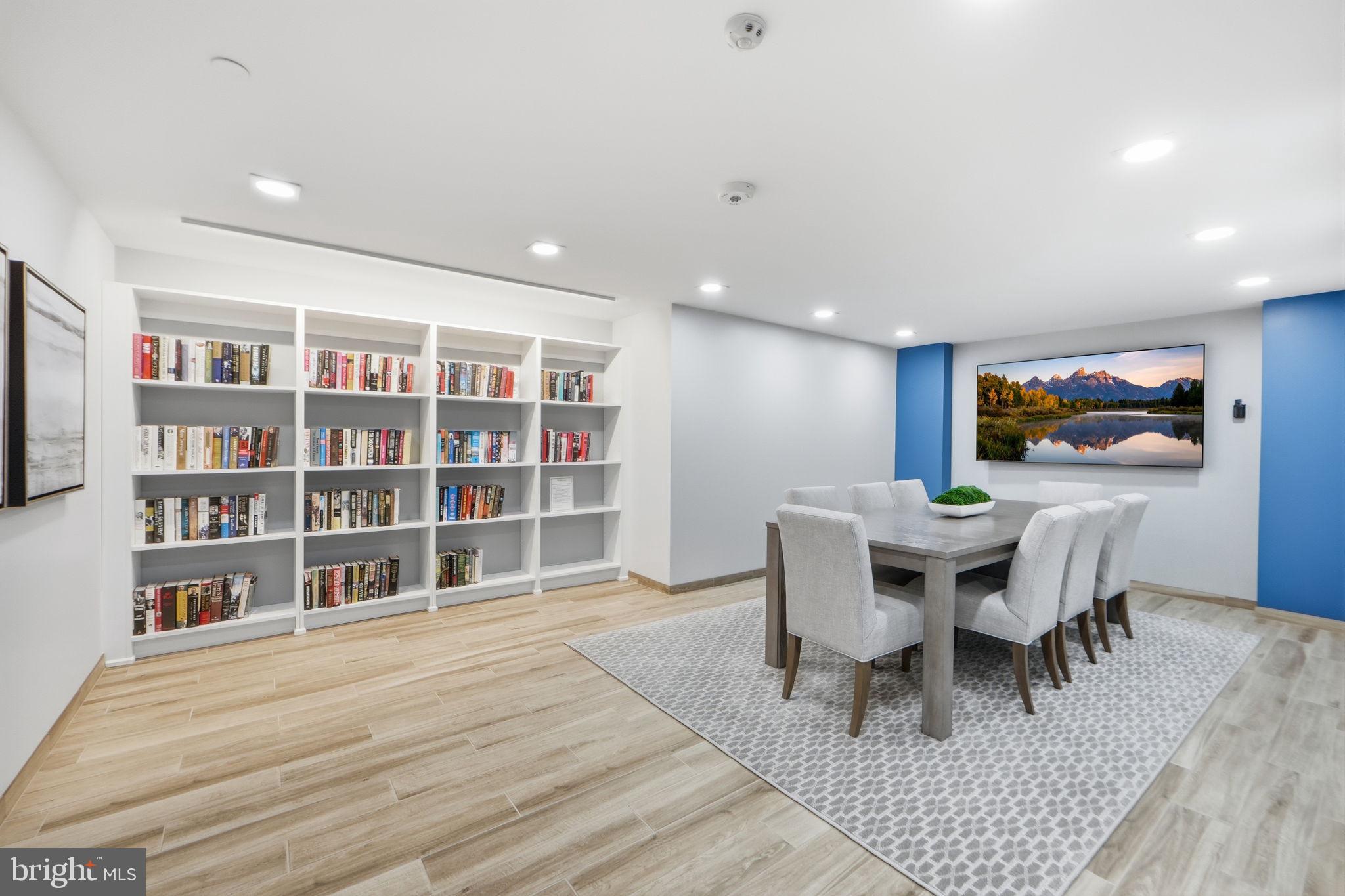 1808 Old Meadow Road, Unit 1201 McLean, VA 22102 - Photo 28 of 37 a view of a dining room with furniture and a wooden floor