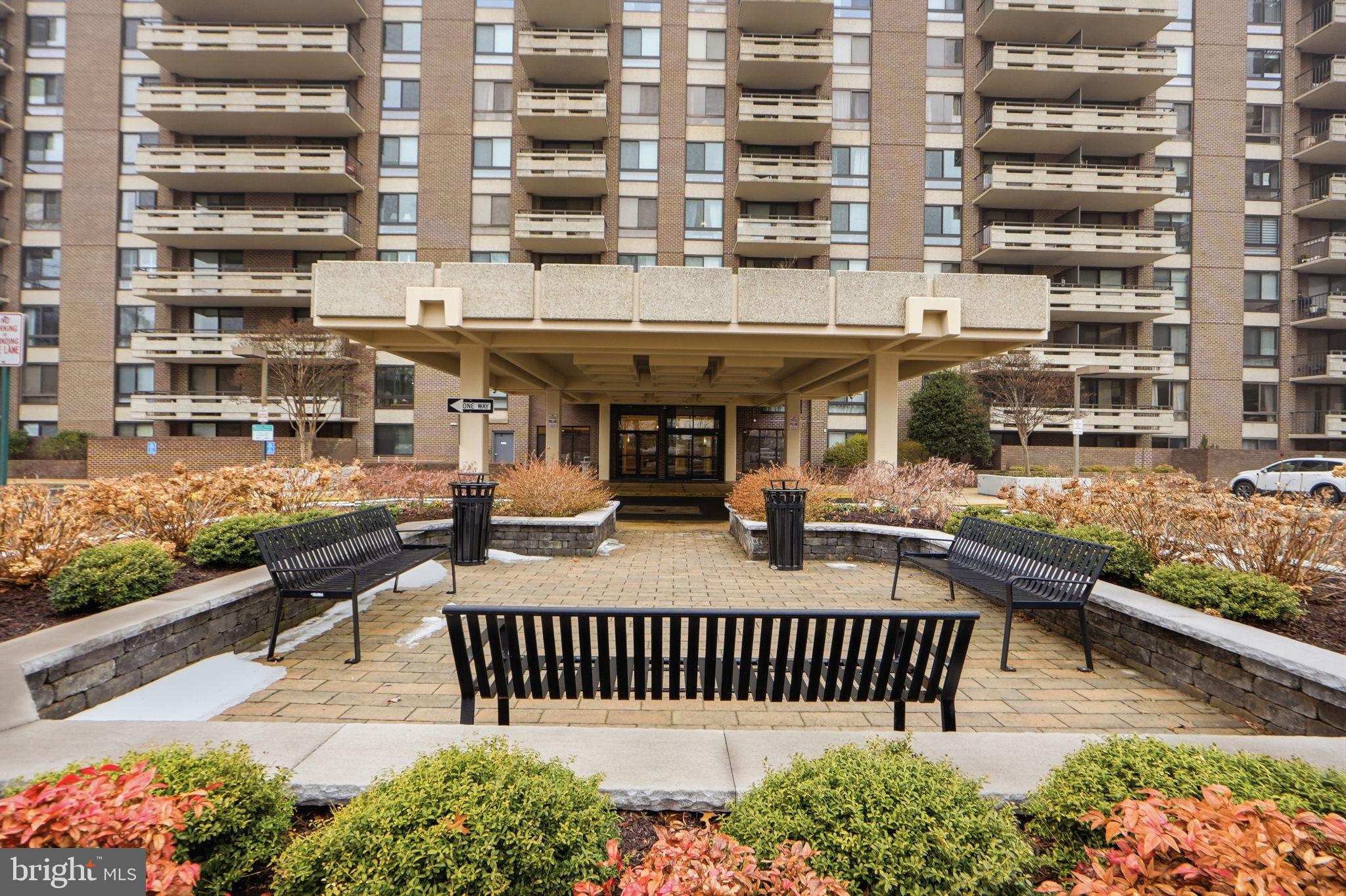 1808 Old Meadow Road, Unit 1201 McLean, VA 22102 - Photo 3 of 37 a front view of a building with glass door and deck
