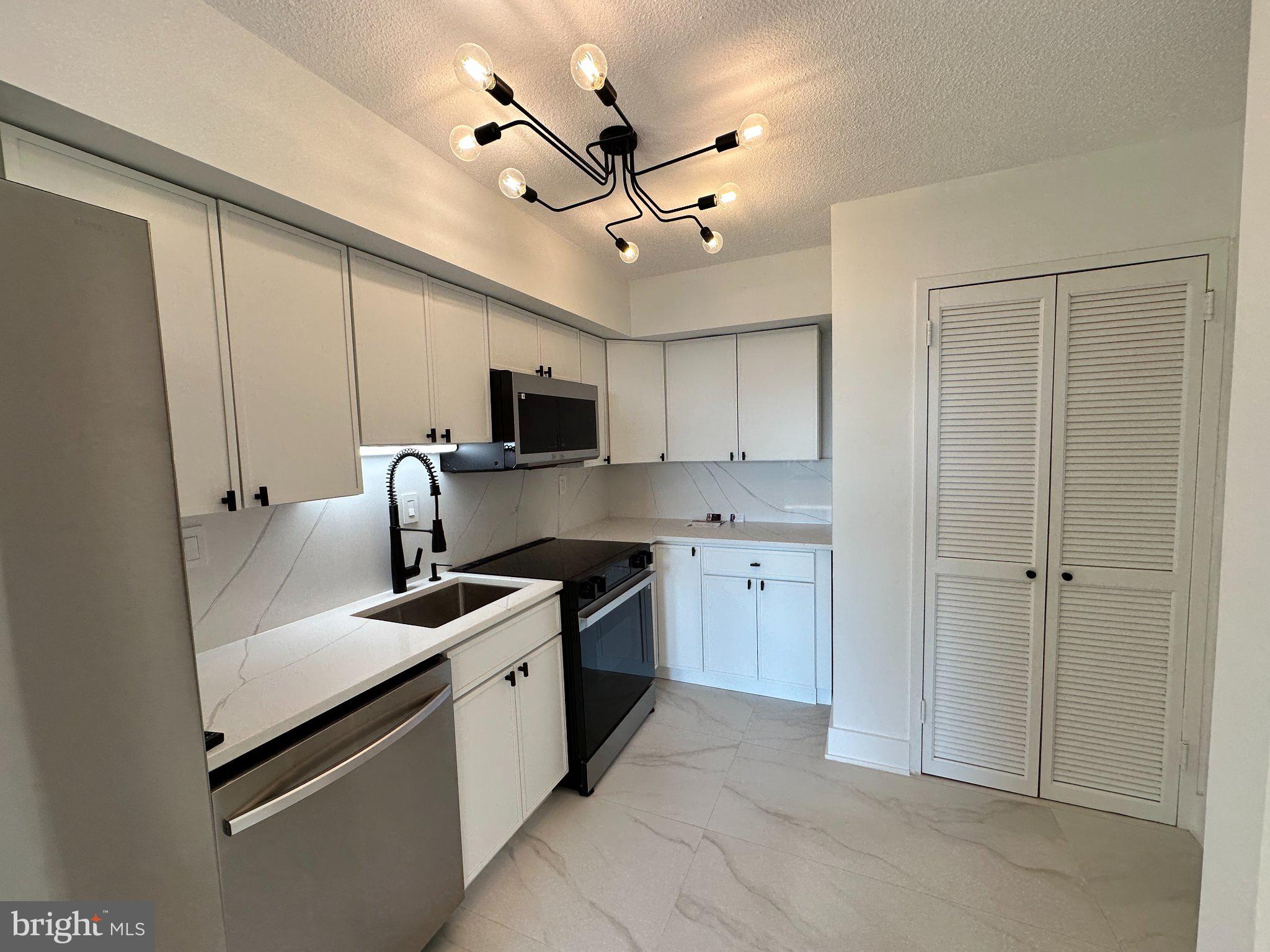 1808 Old Meadow Road, Unit 1201 McLean, VA 22102 - Photo 40 of 40 Modern kitchen with sleek finishes.