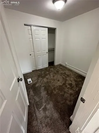 a view of a room that has a window in it