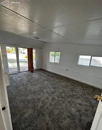 a view of an empty room and window