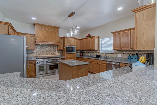a view of a dining room with furniture wooden floor and chandelier