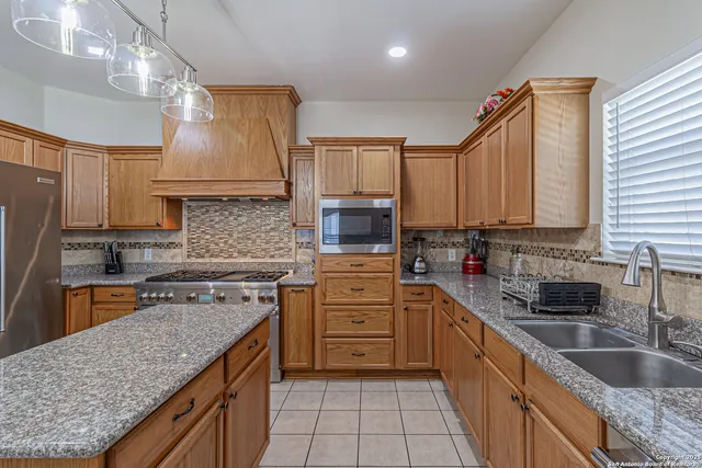 a bedroom with a bed and a lamp