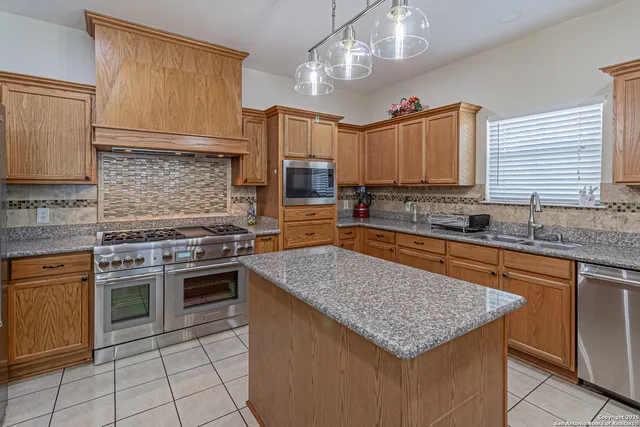 a bathroom with a sink a large mirror and a shower