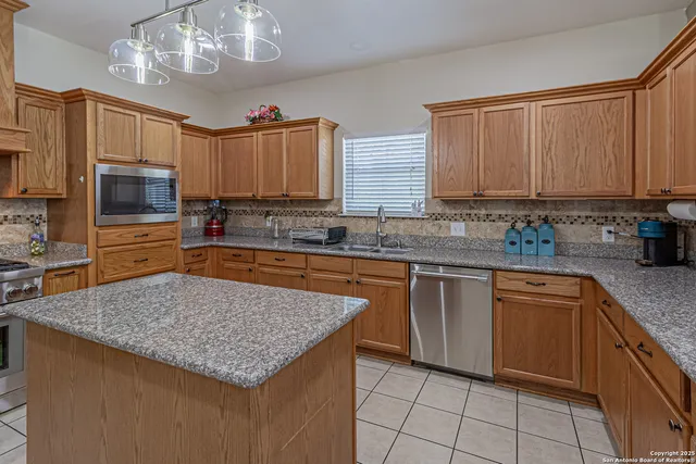 a bathroom with a sink vanity and mirror