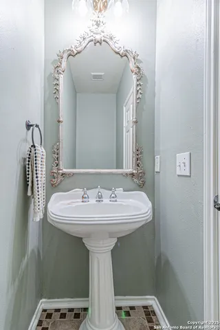 an aerial view of a house with a yard and lake view