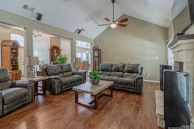 a kitchen with stainless steel appliances granite countertop a stove a sink a refrigerator and a granite counter tops