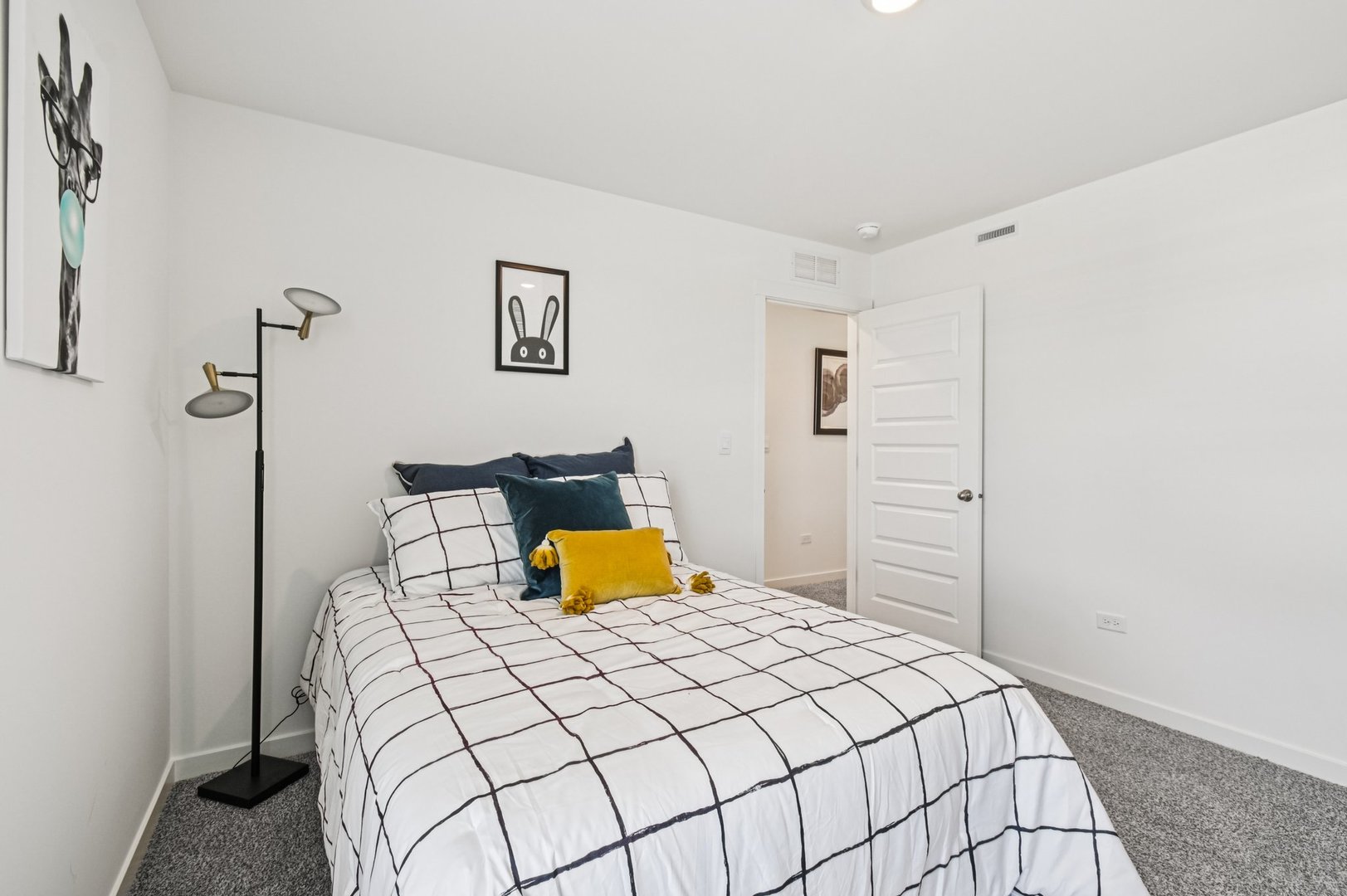 2482 Semillon Street Oswego, IL 60543 - Photo 36 of 45 a bedroom with a bed and lamp