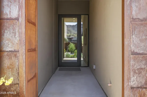 a view of a hallway with windows