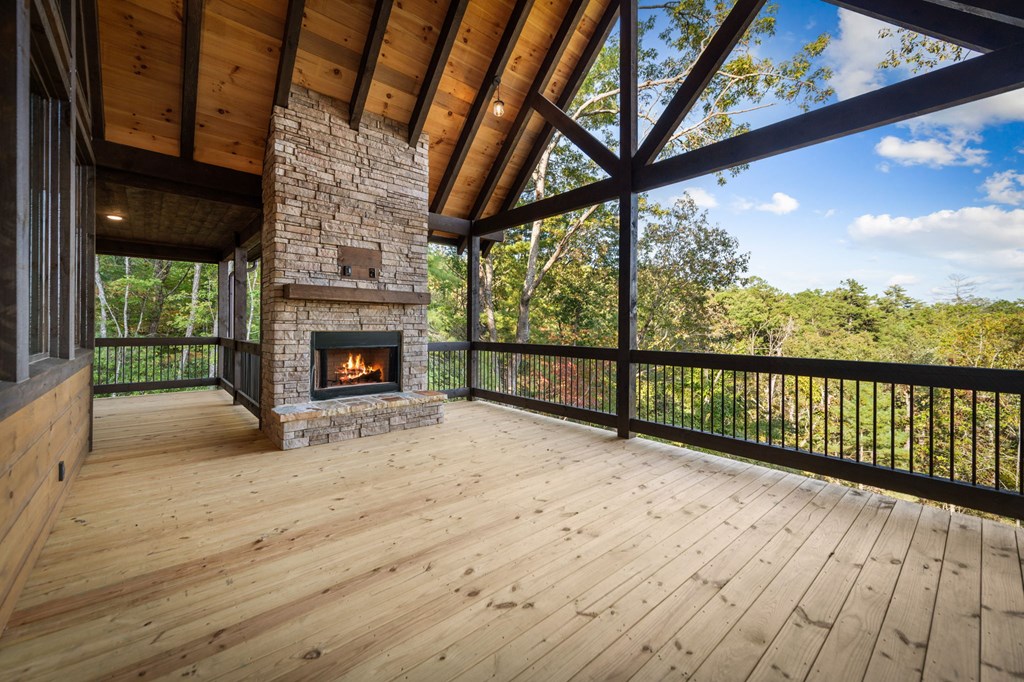 28 Bill Claypool Drive Blue Ridge, GA 30513 - Photo 60 of 60 a view of empty room with wooden floor and fireplace