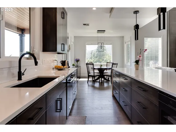a kitchen with sink and cabinets