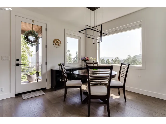 a dining room with furniture and window
