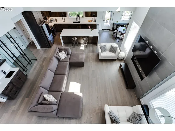 a view of living room with furniture and wooden floor