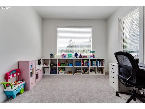 a bedroom with furniture and a window