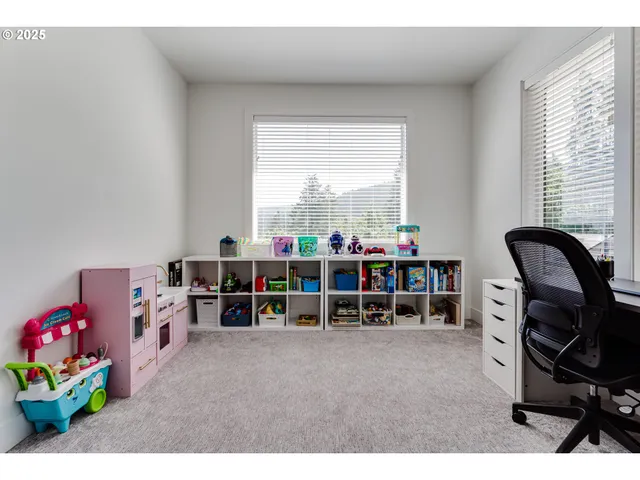 a bedroom with furniture and a window