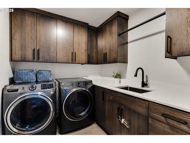 a view of a kitchen with sink and cabinets
