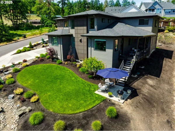 a view of a table and chairs under an umbrella