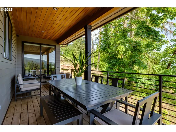 a view of a balcony with potted plants