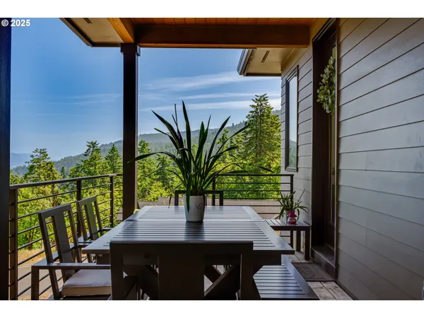 a view of kitchen with granite countertop window