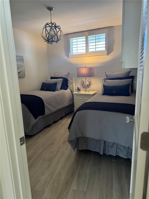 100 Sands Point Road, Unit 223 Longboat Key, FL 34228 - Photo 11 of 16 a bedroom with bed and window