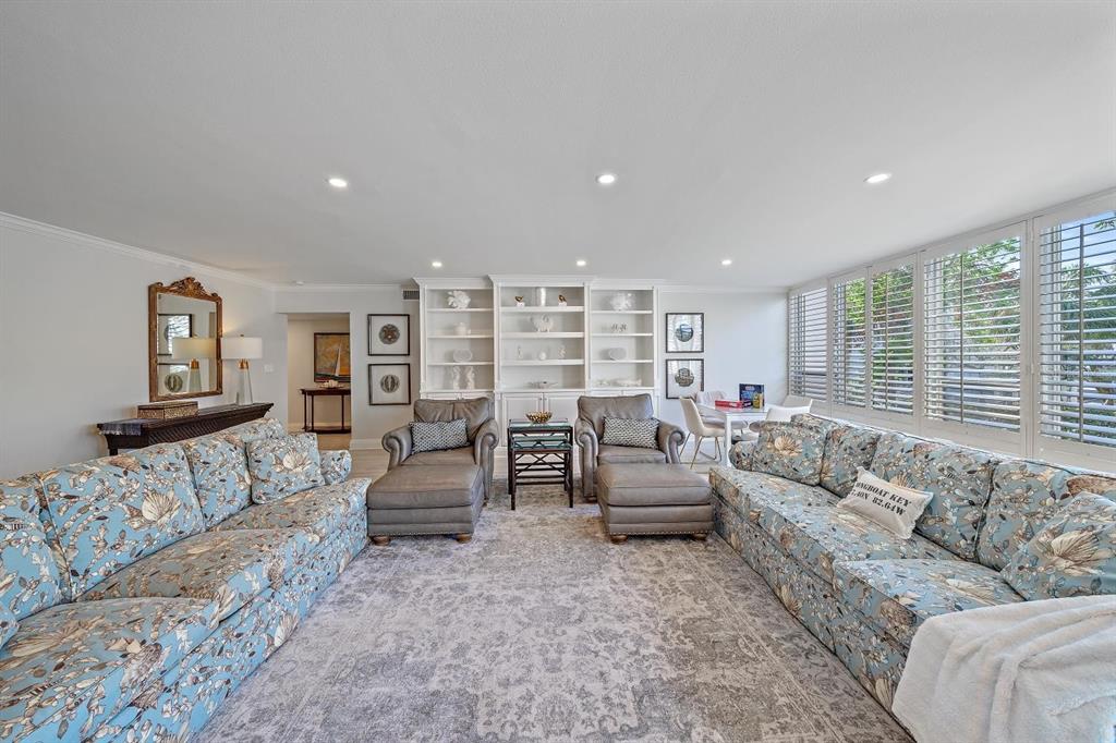 100 Sands Point Road, Unit 223 Longboat Key, FL 34228 - Photo 13 of 16 a living room with furniture and a large window