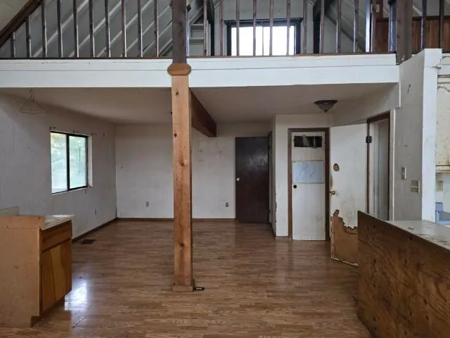 a view of balcony with wooden floor
