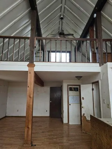a view of a backyard of a house with a porch