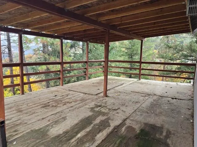 a view of balcony with wooden floor
