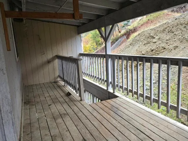 a view of a small space with wooden floor
