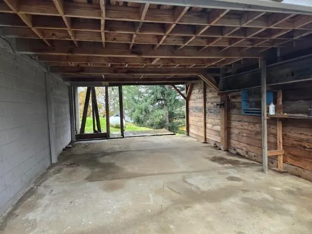 a view of empty room with wooden walls