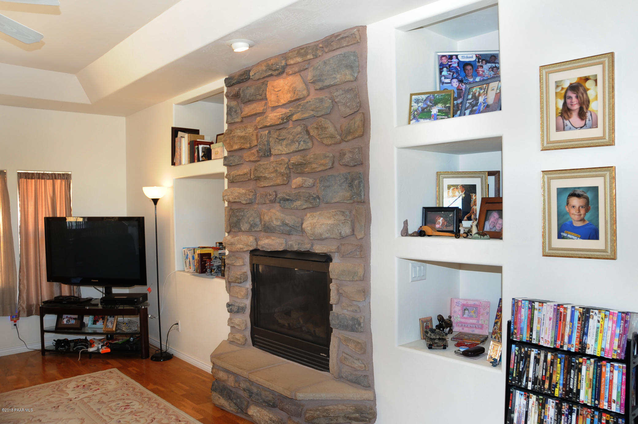 17675 East Rocking J Lane Dewey, AZ 86327 - Photo 4 of 10 a living room with fireplace furniture and a flat screen tv