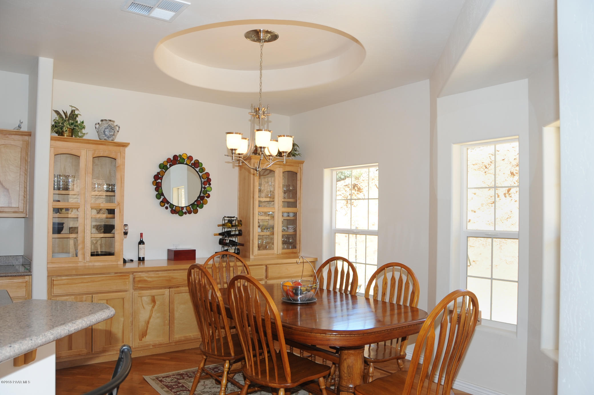 17675 East Rocking J Lane Dewey, AZ 86327 - Photo 7 of 10 a view of a dining room with furniture a chandelier and wooden floor