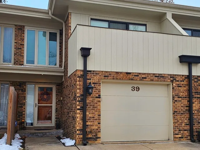a front view of a building with glass windows
