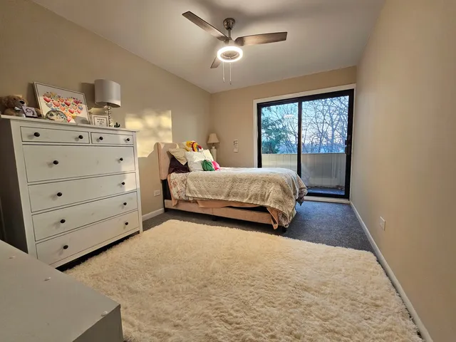 a spacious bedroom with a bed and window