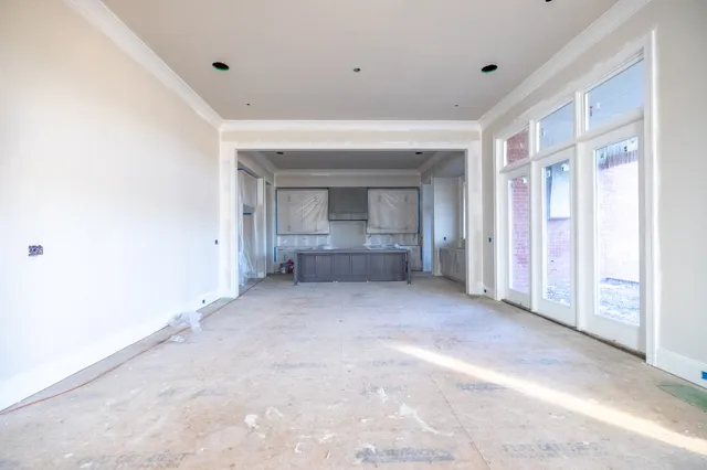 a view of an empty room with a fireplace