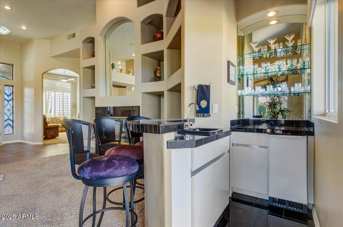25633 North Abajo Drive Rio Verde, AZ 85263 - Photo 14 of 49 a kitchen with stainless steel appliances a stove a sink and a refrigerator
