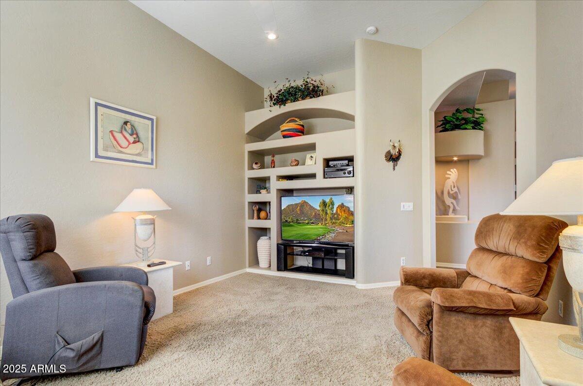 25633 North Abajo Drive Rio Verde, AZ 85263 - Photo 21 of 49 a living room with furniture and a lamp