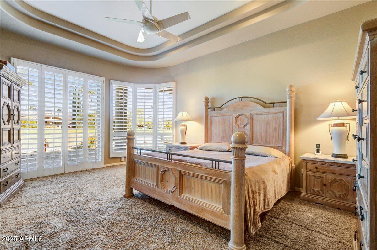 25633 North Abajo Drive Rio Verde, AZ 85263 - Photo 22 of 49 a bedroom with a large bed and a window