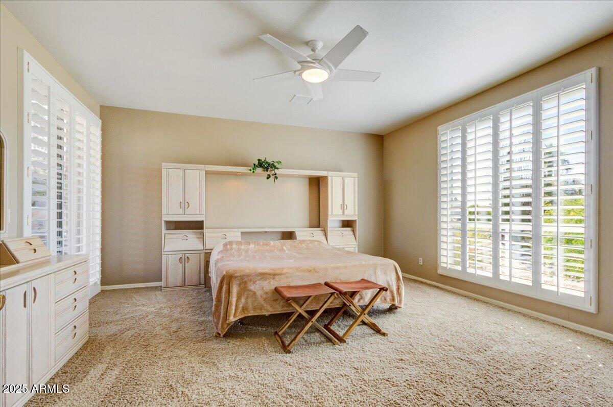 25633 North Abajo Drive Rio Verde, AZ 85263 - Photo 25 of 49 a bedroom with a bed and a large window with outer view