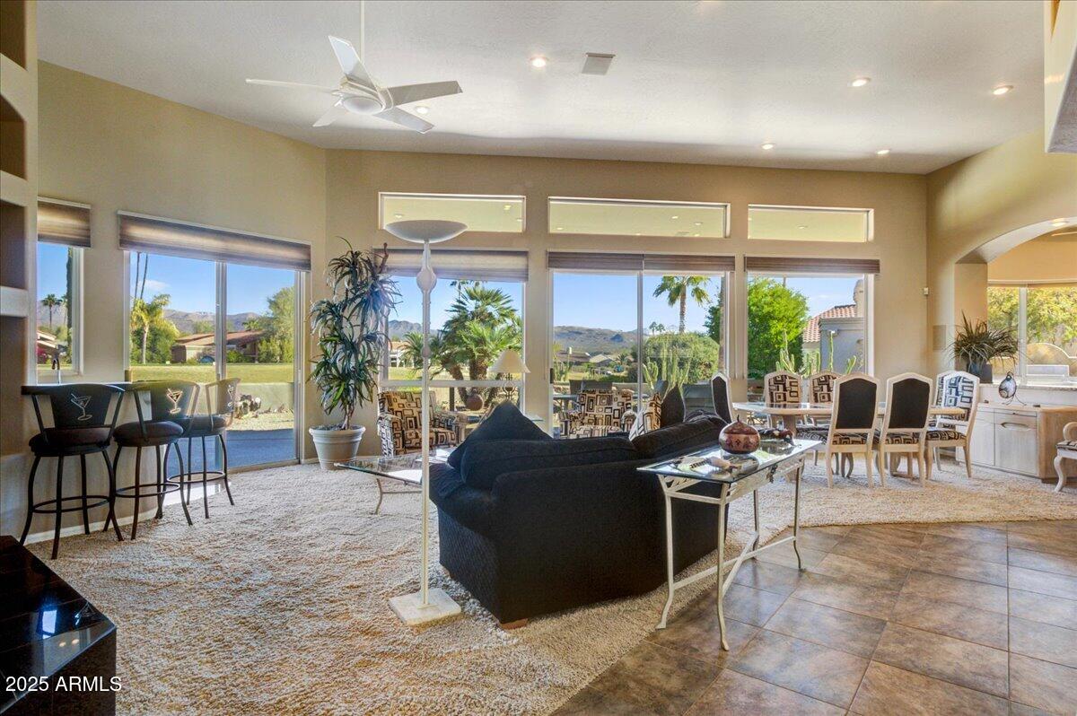 25633 North Abajo Drive Rio Verde, AZ 85263 - Photo 10 of 49 a living room with furniture a large window and chairs