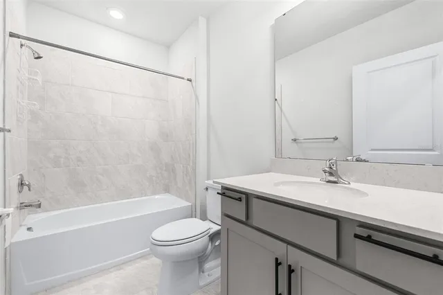 a bathroom with a sink a toilet and a bathtub