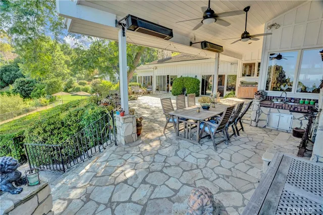a living room with furniture a fireplace and a table
