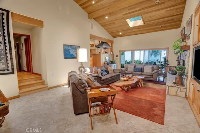 a bedroom with 2 bed chair and a large window