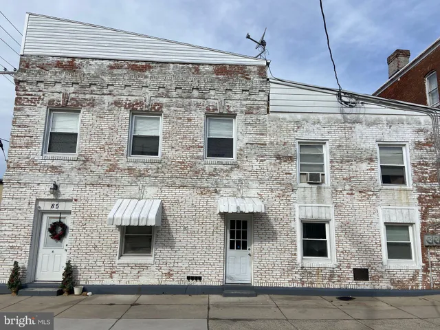 a view of a brick wall of the house