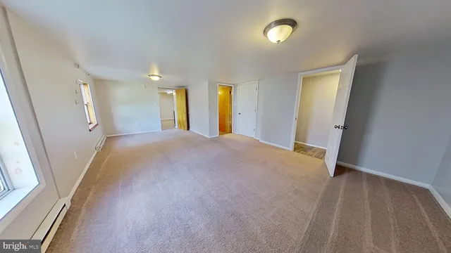 a view of a livingroom with a staircase